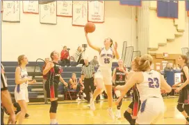  ?? Photo by Becky Polaski ?? Maura Caskey, 25, takes the ball to the hoop toward the end of St. Marys Area’s 23-point run to close out the first half of Tuesday’s game against Brockway.