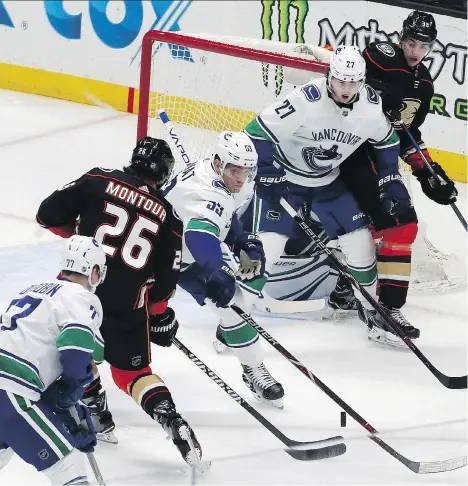  ?? REED SAXON/THE ASSOCIATED PRESS ?? Brandon Montour and the Anaheim Ducks — who are fighting for a playoff spot — were hungry for two points Wednesday when the Canucks came to town for a visit. They accomplish­ed their goal, and Vancouver has now been blanked in three consecutiv­e games.