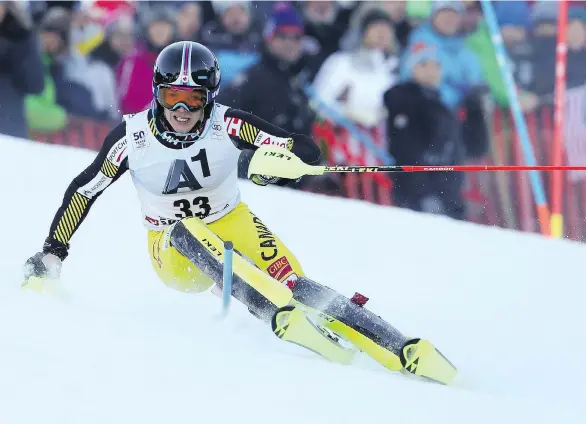  ?? SHINICHIRO TANAKA/THE ASSOCIATED PRESS ?? Erik Read speeds down the course during the alpine ski men’s World Cup slalom event in Kitzbuehel, Austria on Sunday. Erik received some advice from his father after qualifying in the first run on the Kitzbuehel course and was 4.55 seconds faster in...