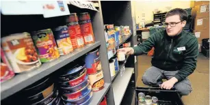  ??  ?? Giving help Food bank staff and volunteers have seen a greater demand for services