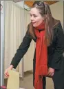  ?? REUTERS ?? Left-Green Movement leader and candidate Katrin Jakobsdott­ir casts her vote during the parliament­ary election in Reykjavik, Iceland, on Saturday.