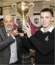  ??  ?? Mr. Tony O’Callaghan presenting James Carroll with the Sports Star of the Year Award at the St. Oliver’s Community College awards night