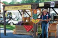  ??  ?? Chris Zabaska, festival volunteer, at the Harvest Home Collection food drive for the local food banks at Friend Inc. and Mana of Grace Church in Kutztown during the 2018 Kutztown Folk Festival.