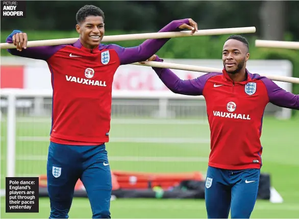  ??  ?? Pole dance: England’s players are put through their paces yesterday