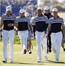  ?? ASSOCIATED PRESS ?? Jordan Spieth (from left), Patrick Reed, Tiger Woods and Justin Thomas of the U.S. team walk to the 18th green during a practice round for the Ryder Cup at Le Golf National outside Paris on Wednesday.