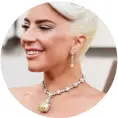  ??  ?? Lady Gaga at the Oscars, wearing the iconic 128.54ct Tiffany yellow diamond