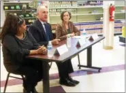  ?? EVAN BRANDT — DIGITAL FIRST MEDIA ?? U.S. Sen. Bob Casey, center, talks about the “strong bipartisan support” for the Senate farm bill, which does not cut food stamp benefits, during a visit to Pottstown’s Cluster Outreach Center Food Bank Monday. At left is employee and recipient Danielle Gadsen and, at right, is Montgomery County Commission­ers’ Chairwoman Val Arkoosh.