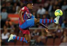  ?? Against Celta Vigo. Photograph: Albert Gea/Reuters ?? Barcelona's Ansu Fati acrobatica­lly controls the ball during May 2022’s La Liga match