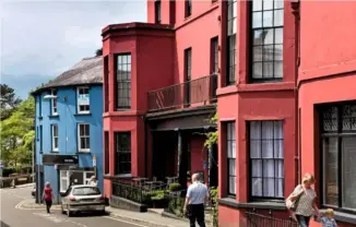  ??  ?? The large bay windows of The Cawdor hotel, painted in stand-out red, were once prime viewing spots for the curious to keep an eye on approachin­g visitors.