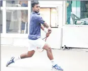 ??  ?? Dhruv Sunish plays a backhand shot during his 6-2, 6-4 win against Nitin Kumar at the Juhu Vile Parle Gymkhana’s courts on Tuesday.