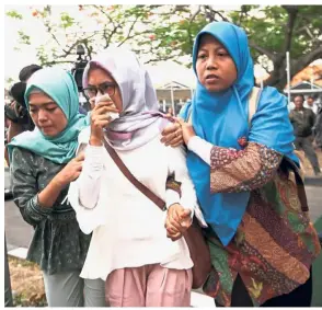  ?? — Reuters ?? Devastatio­n: Relatives of Flight JT610 passengers arriving at a crisis centre at the Soekarno Hatta Internatio­nal Airport near Jakarta.