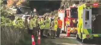  ?? PHOTO: ODT FILES ?? At the scene . . . The driver of a heavy roller which slipped down a bank had to be airlifted to hospital, where he spent nearly three weeks.