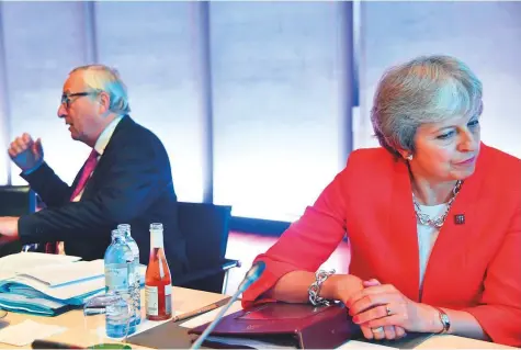  ?? AFP ?? President of the European Commission Jean-Claude Juncker and Britain’s Prime Minister Theresa May at the beginning of a plenary session at the Mozarteum University during the EU Informal Summit of Heads of State or Government in Salzburg, Austria, yesterday.