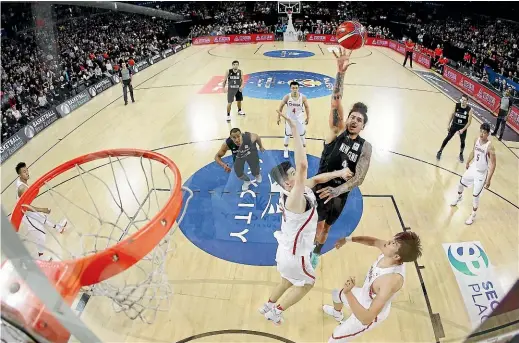  ?? GETTY IMAGES ?? Tall Blacks power forward Isaac Fotu puts up a shot during New Zealand’s impressive win over China in Auckland. Fotu turned down a chance to play for the famed Boston Celtics, preferring to step out for his country.