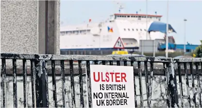  ?? ?? A sign at Larne harbour in Northern Ireland: dropping parts of the Protocol would be a proportion­ate measure to preserve the Belfast Agreement