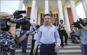  ?? MICHAEL CLEVENGER — THE COURIER-JOURNAL VIA AP ?? Louisville men’s basketball coach Rick Pitino leaves Grawemeyer Hall after having a meeting with the university’s interim president Greg Postel, Wednesday in Louisville. Ky. Louisville announced Wednesday that they have placed Pitino and athletic...