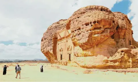  ?? Manfred Thuerig / TNS ?? Tourists visit Hegra, a UNESCO World Heritage Site, in the greater region of Al-Ula.