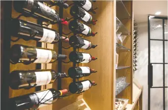  ??  ?? When planning the wine racks for a home wine cellar, experts say to keep in mind that not all bottles are the same size or shape.