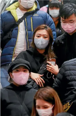  ?? AP ?? People wear masks at a metro station in Taipei, Taiwan. According to the Taiwan Centers of Disease Control yesterday, the eighth case diagnosed with the 2019 novel coronaviru­s (2019-nCoV) has been confirmed in Taiwan.