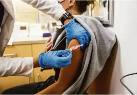 ?? Stephen Lam / The Chronicle 2021 ?? While a vaccine is developed for the flu each year, COVID’s lack of seasonalit­y will make it more difficult to produce an effective vaccine annually.