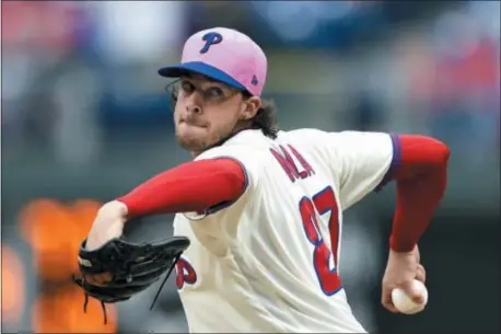  ?? THE ASSOCIATED PRESS ?? Phillies starting pitcher Aaron Nola throws during the fourth inning against the Mets.