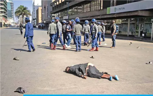  ?? — AFP ?? In this file photo taken on Aug 16, 2019, a protester lies unconsciou­s on the ground after being beaten by police near Unity Square in Harare.