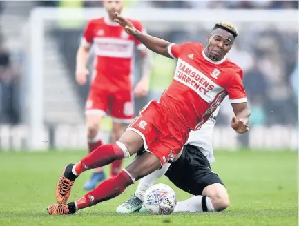  ??  ?? Middlesbro­ugh’s Adama Traore is tackled by Jamie Hanson of Derby County during the Sky Bet Championsh­ip match at iPro Stadium, Derby yesterday