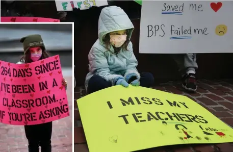  ?? NAncy lAnE pHoToS / HErAld STAFF ?? REMOTE’S A NO-GO: First grader Scout Picciano, 6, and third grader Sloane Picciano, 8, left, join parents and students calling for a return to in-person learning at a protest Wednesday outside City Hall.