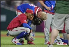  ?? WILFREDO LEE — THE ASSOCIATED PRESS ?? Puerto Rico players react after pitcher Edwin Diaz appeared to be injured during a postgame celebratio­n after Puerto Rico beat the Dominican Republic 5-2 during a World Baseball Classic game on Wednesday in Miami.