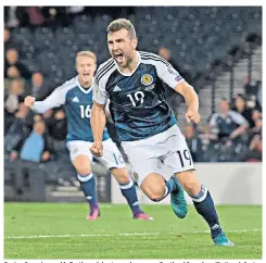  ??  ?? Saving face: James McCarthy celebrates as he spares Scotland from humiliatin­g defeat