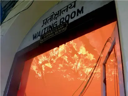  ?? AFP ?? Fire burns at a railway station during an indefinite strike called by the Gorkha Janamukti Morcha in Darjeeling on Saturday. —