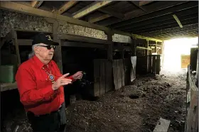  ?? NWA Democrat-Gazette/ANDY SHUPE ?? Glenn Jones, a Benton County historic preservati­on commission­er, speaks Friday at Fitzgerald Station on Old Wire Road in Springdale. The property recently went into foreclosur­e, creating concern for its future among local preservati­onists.