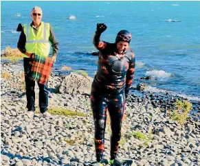  ??  ?? Louisa Welsh celebrates her victory after swimming Lake Ohau for charity.