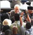  ?? AFP ?? Former Malaysia’s prime minister Najib Razak (centre) greets supporters after a court appearance in Kuala Lumpur on Thursday.