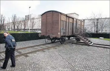  ?? Jack Guez AFP/Getty Images ?? A RAILWAY CAR, shown in 2005, in the Paris suburb of Drancy commemorat­es the deportatio­n of 76,000 Jews and others from France to Auschwitz and other Nazi concentrat­ion camps during World War II.