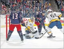  ?? [KYLE ROBERTSON/DISPATCH] ?? Predators goalie Pekka Rinne stops a third-period shot by the Blue Jackets’ Boone Jenner, center, as the Jackets’ Cam Atkinson and the Predators’ Roman Josi look on.