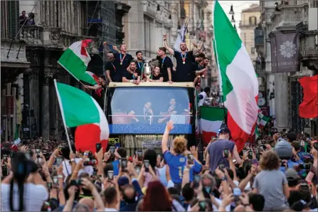  ?? The Associated Press ?? Italy’s players celebrate in Rome, Monday, after winning the Euro 2020 soccer championsh­ips at Wembley stadium in London a day earlier. Italy beat England 3-2 in a penalty shootout after a 1-1 draw during regulation.