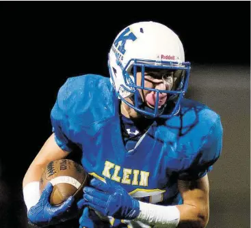  ?? Jerry Baker photos / For the Chronicle ?? Klein sophomore wide receiver Colton Chelootz eyes the end zone on his touchdown against Klein Oak during their District 15-6A match-up at Klein Memorial Stadium last weekend.
