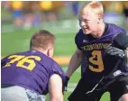  ?? MARK HOFFMAN / MILWAUKEE JOURNAL SENTINEL ?? Defensive end Chandler Voight (right) takes part in Oconomowoc's first football practice of the year Tuesday.