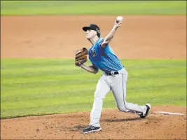  ?? Wilfredo Lee The Associated Press ?? Pitcher Adam Conley participat­es in a workout Tuesday at Marlins Park in Miami.