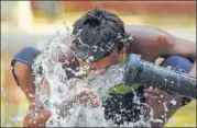  ?? SUBHANKAR CHAKRABORT­Y/HT PHOTO ?? ▪ A man drinks water from a pipe on a hot afternoon in Lucknow on Friday.