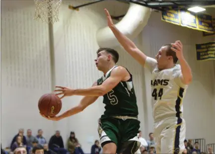  ?? THOMAS NASH - DIGITAL FIRST MEDIA ?? Methacton’s Marcus Girardo (5) gets past Spring-Ford’s Robert Bobeck (44) on the way to a basket during the first half of Thursday’s game.