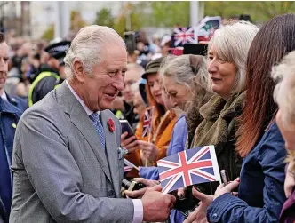  ?? ?? > King Charles III greeting members of the public. See question 3