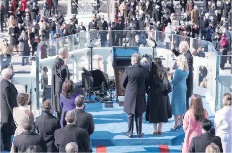  ?? TASOS KATOPODIS/AP ?? Joe Biden is sworn in as the 46th president of the United States by Chief Justice John Roberts as Jill Biden holds the Bible during Wednesday’s inaugurati­on at the in Washingoto­n.