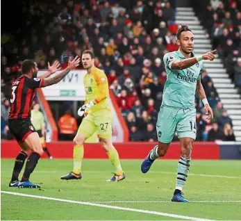  ??  ?? Bulls-eye!: Arsenal’s Pierre-Emerick Aubameyang celebratin­g after scoring the winner against Bournemout­h during their English Premier League match at the Vitality Stadium yesterday. — Reuters