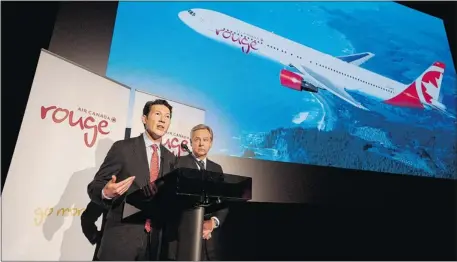  ?? Aaron Vincent Elkaim/the Canadian Press ?? Executive vice-president Ben Smith, left, and CEO of Air Canada Leisure Group, Michael Friisdahl unveil Air Canada Rouge in Toronto on Tuesday.