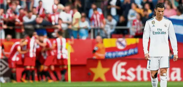  ??  ?? Real pain: Real Madrid’s Cristiano Ronaldo looking dejected after Girona scored their second goal. — Reuters