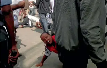  ?? AP ?? People fall over in the rush to get away, after an explosion at a rally for Ethiopia’s new Prime Minister Abiy Ahmed in Addis Ababa.