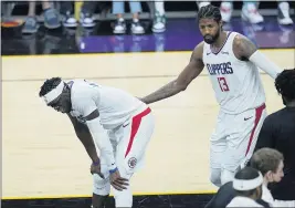  ?? ROSS D. FRANKLIN — THE ASSOCIATED PRESS ?? Clippers guards Paul George, right, and Reggie Jackson catch a break during the second half of Game 1of the Western Conference finals against the Phoenix Suns on Sunday.