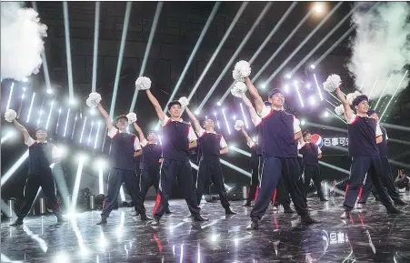  ?? Above: Campus. PHOTOS PROVIDED TO CHINA DAILY ?? Top: The cheerleadi­ng squad of Pu’er University seeks to integrate different ethnic cultural elements in Yunnan province into their routines. The cheerleadi­ng squad makes a debut at the online reality show
